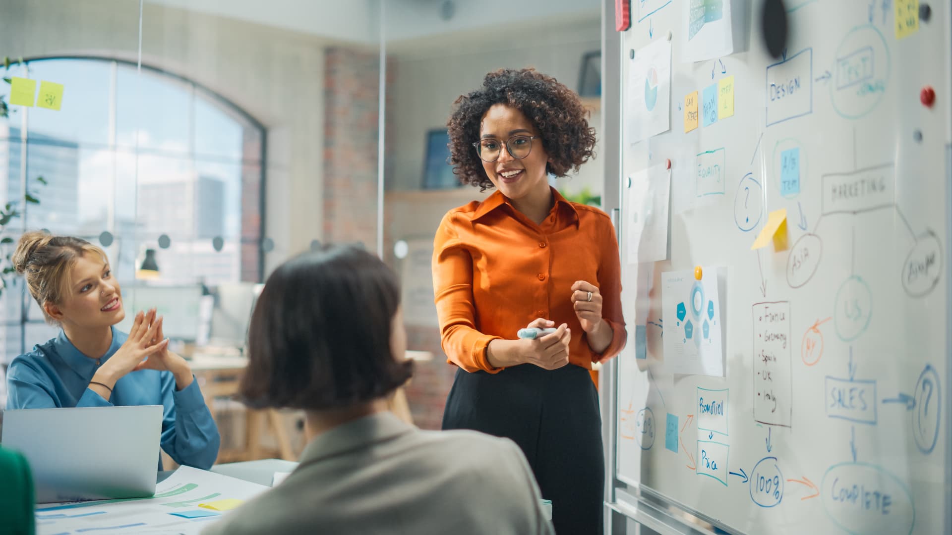 Professionals discussing a workflow during a team session